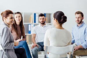 group-of-people-sitting-in-circle-on-chairs-during-2023-11-27-05-30-28-utc_1618x1080-q80